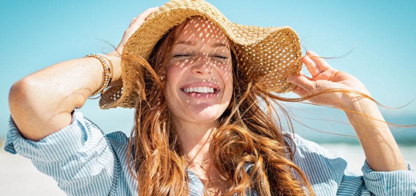 Wear a hat or scarf to shield your tresses from the sun's damaging rays.